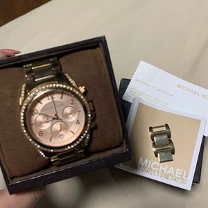 Michael Kors rose gold watch.